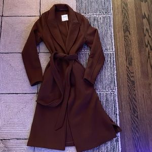 Coat is medium weight for warmth. this coat hangs just below the knee.